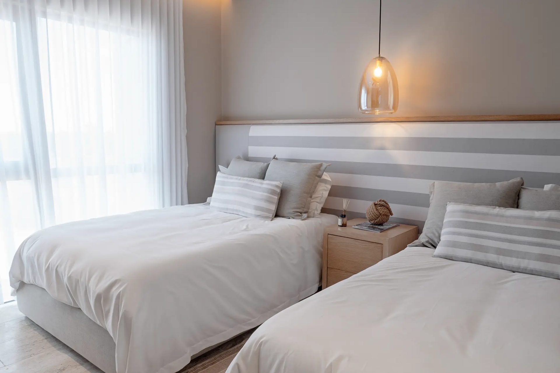 Bonanza B-707 — guest bedroom with twin beds and striped headboard