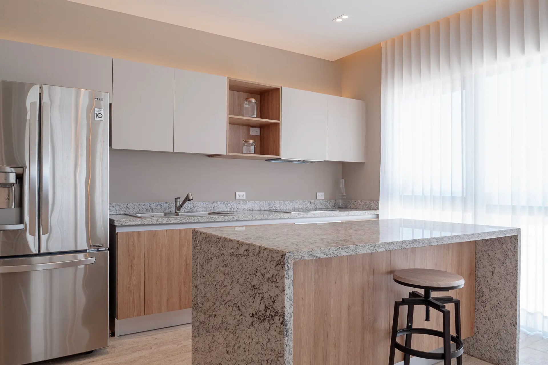 Bonanza B-707 — kitchen with granite countertops and LG appliances