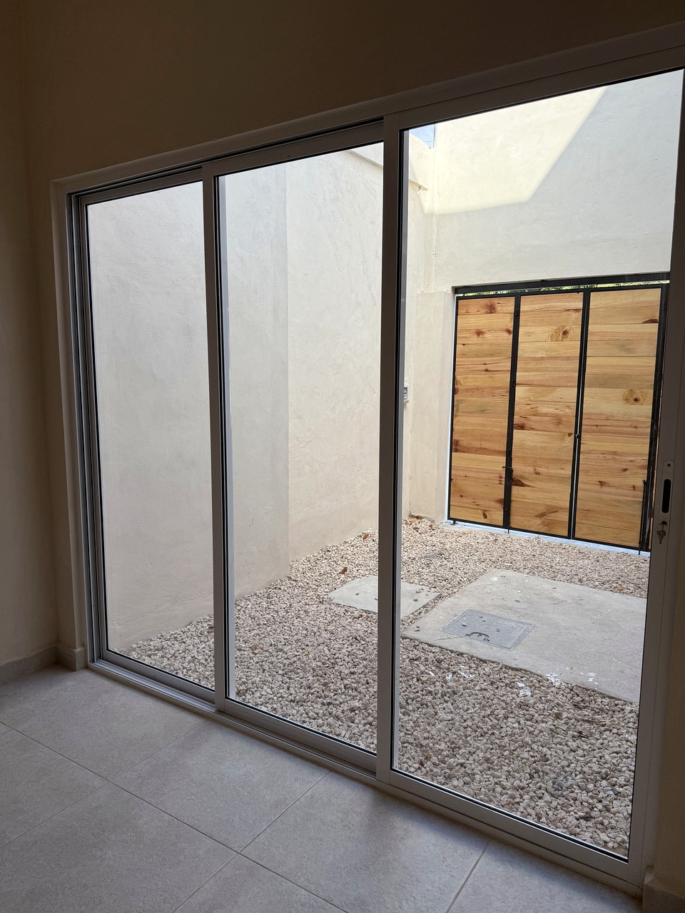 Casa Suspiro — contemporary wooden entrance doors with glass panels